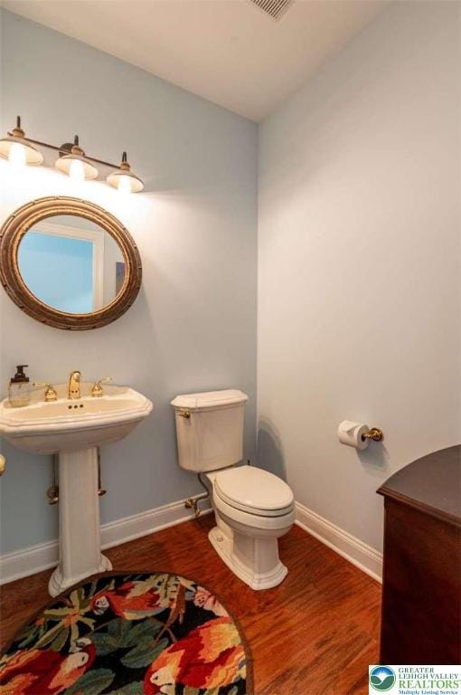 4741 Pinehurst Cir, Upper Saucon Twp, PA 18034 - bathroom with baseboards, wood finished floors, and toilet