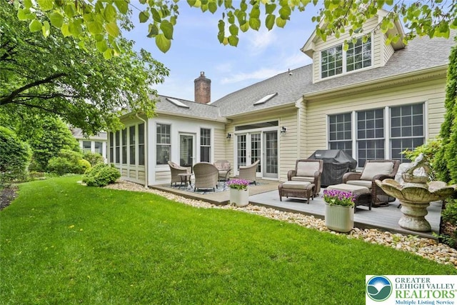 4741 Pinehurst Cir, Upper Saucon Twp, PA 18034 - back of house featuring a yard, a patio, a shingled roof, a chimney, and a sunroom