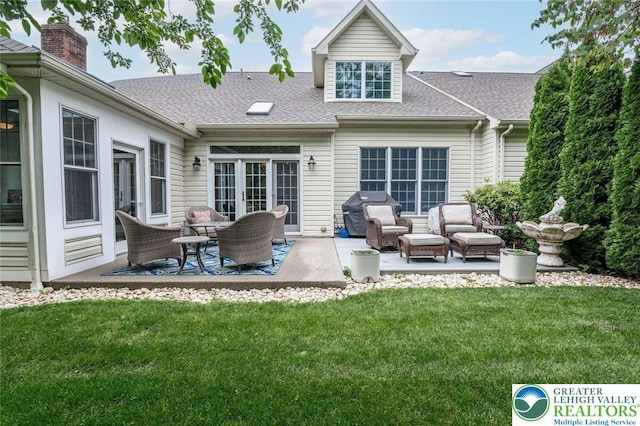 4741 Pinehurst Cir, Upper Saucon Twp, PA 18034 - back of house with a patio, a yard, a shingled roof, an outdoor living space, and a chimney
