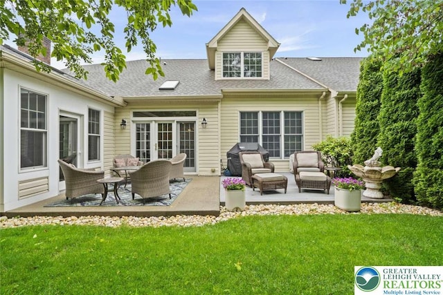4741 Pinehurst Cir, Upper Saucon Twp, PA 18034 - rear view of house featuring a patio, a lawn, outdoor lounge area, and roof with shingles