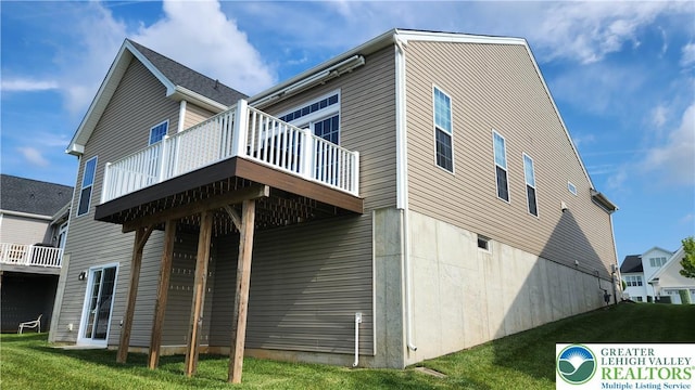 4082 Rutz Ln, South Whitehall Twp, PA 18104 - view of home's exterior with a wooden deck and a lawn