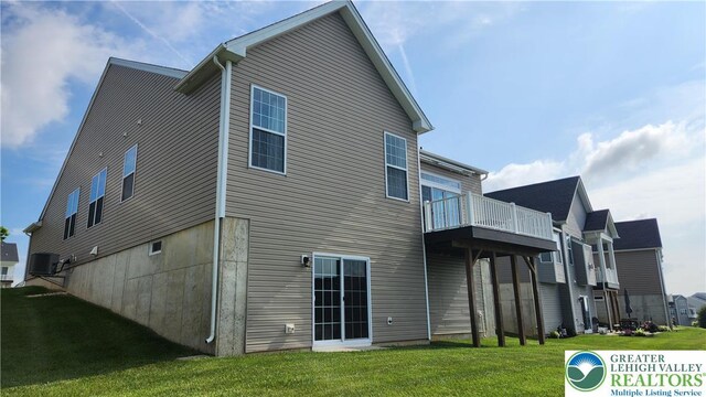 4082 Rutz Ln, South Whitehall Twp, PA 18104 - back of property with a yard, central AC unit, and a wooden deck