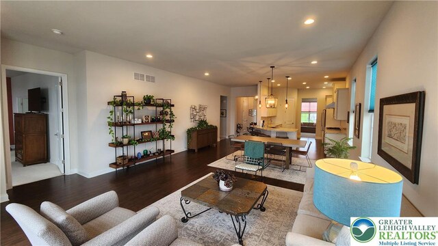 4082 Rutz Ln, South Whitehall Twp, PA 18104 - living area featuring wood finished floors, recessed lighting, and baseboards
