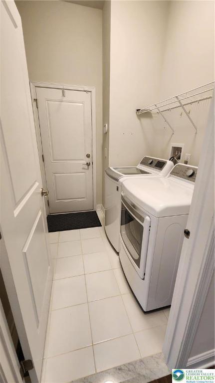 4082 Rutz Ln, South Whitehall Twp, PA 18104 - laundry area with separate washer and dryer and light tile patterned floors