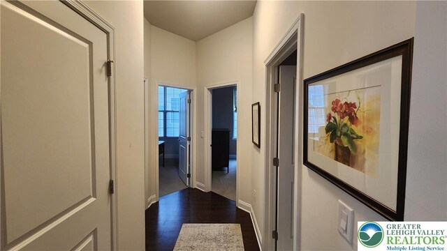 4082 Rutz Ln, South Whitehall Twp, PA 18104 - hallway with dark wood-style floors and baseboards
