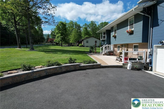 8539 Rextown Rd, Slatington Borough, PA 18080 - view of green lawn featuring a patio
