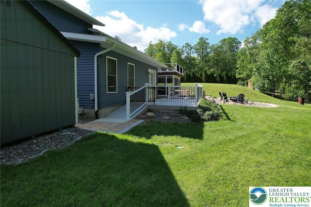 8539 Rextown Rd, Slatington Borough, PA 18080 - view of grassy yard with a wooden deck and an outdoor fire pit