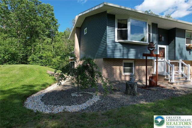 8539 Rextown Rd, Slatington Borough, PA 18080 - view of side of property with a lawn and brick siding
