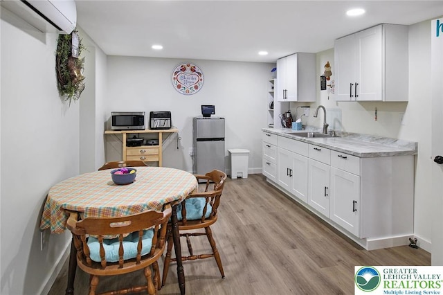 8539 Rextown Rd, Slatington Borough, PA 18080 - kitchen with a wall mounted air conditioner, a sink, appliances with stainless steel finishes, light countertops, and open shelves