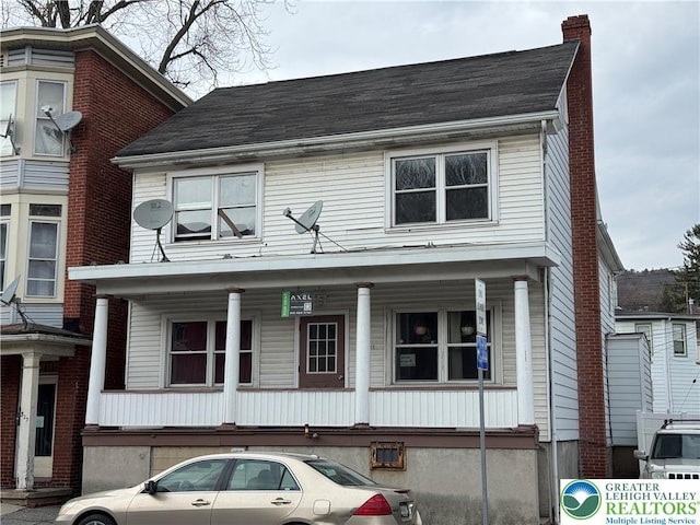 321 W Broad St, Tamaqua Borough, PA 18252 - view of front of house featuring a chimney, covered porch, and a shingled roof