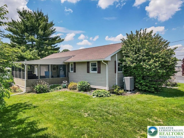 2934 Keystone St, Bethlehem Twp, PA 18020 - view of front of home featuring cooling unit, a sunroom, and a front yard