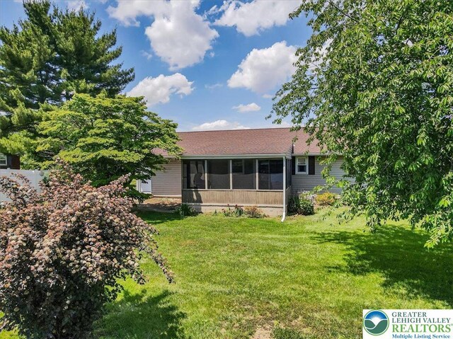 2934 Keystone St, Bethlehem Twp, PA 18020 - back of property featuring a sunroom and a yard