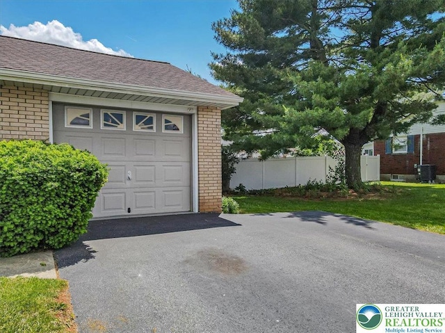 2934 Keystone St, Bethlehem Twp, PA 18020 - garage featuring cooling unit and asphalt driveway