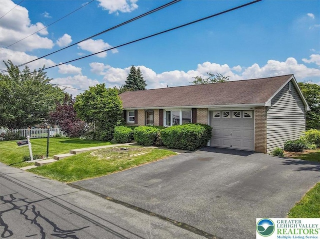 2934 Keystone St, Bethlehem Twp, PA 18020 - ranch-style house with brick siding, a garage, and driveway