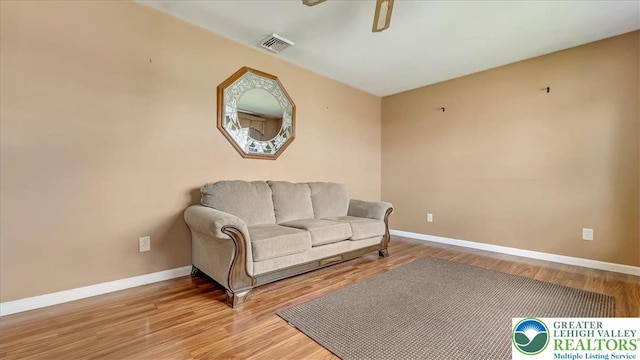 2934 Keystone St, Bethlehem Twp, PA 18020 - living area featuring baseboards, wood finished floors, and a ceiling fan