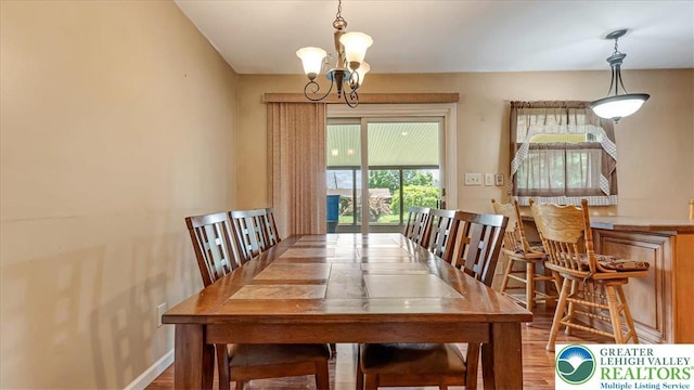 2934 Keystone St, Bethlehem Twp, PA 18020 - dining area with a chandelier, wood finished floors, and baseboards