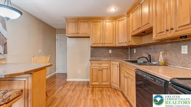 2934 Keystone St, Bethlehem Twp, PA 18020 - kitchen featuring dishwasher, light wood-style flooring, a sink, decorative backsplash, and light countertops