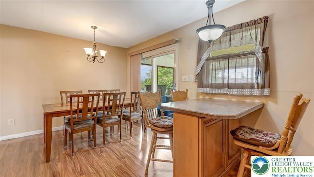 2934 Keystone St, Bethlehem Twp, PA 18020 - dining area with light wood finished floors, baseboards, and a chandelier