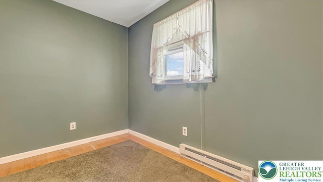 2934 Keystone St, Bethlehem Twp, PA 18020 - unfurnished room featuring a baseboard radiator, baseboards, and wood finished floors