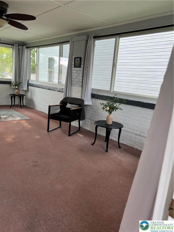 1540 Riegel St, Hellertown Borough, PA 18055 - sitting room with carpet, ceiling fan, and brick wall