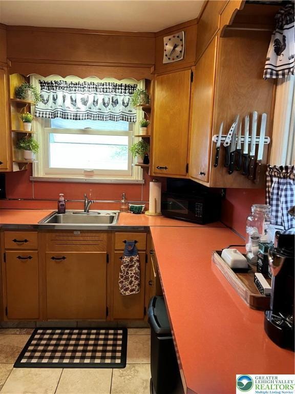 1540 Riegel St, Hellertown Borough, PA 18055 - kitchen with black microwave, open shelves, a sink, and light countertops