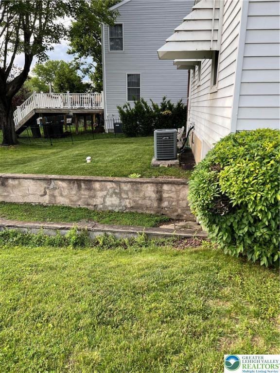 1540 Riegel St, Hellertown Borough, PA 18055 - view of green lawn with central AC unit and a wooden deck