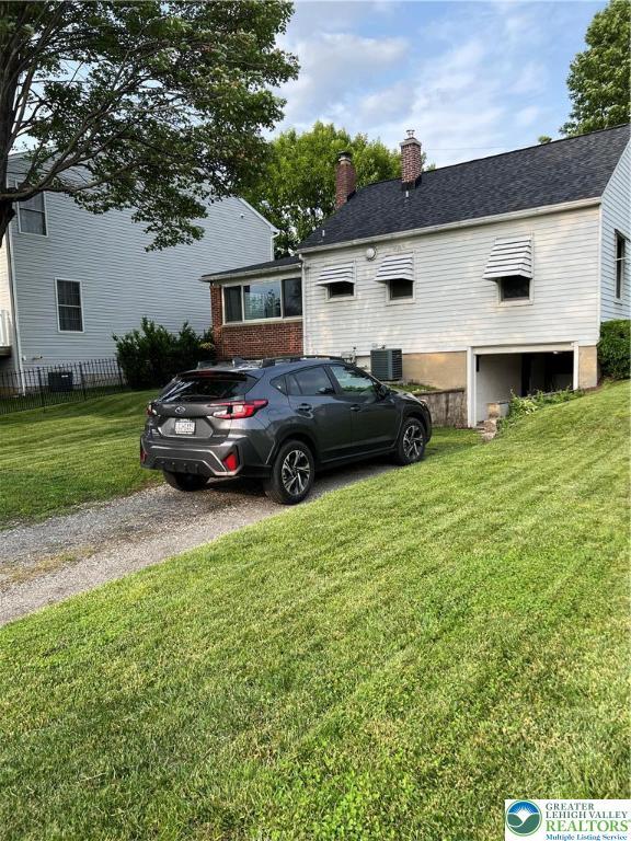 1540 Riegel St, Hellertown Borough, PA 18055 - view of front of property featuring central air condition unit and a chimney