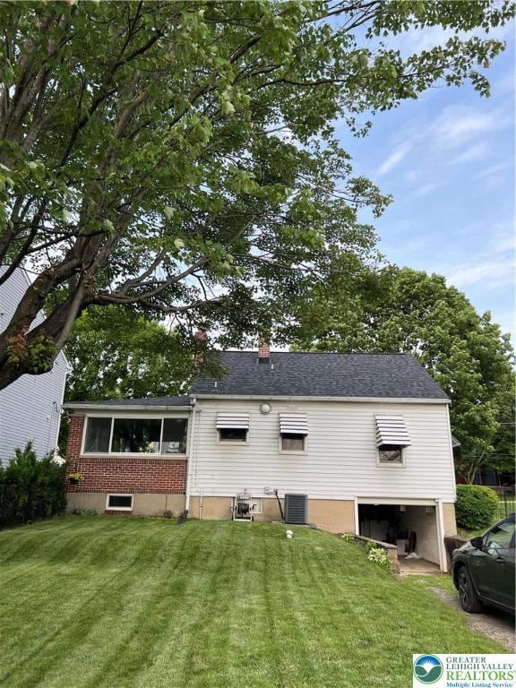 1540 Riegel St, Hellertown Borough, PA 18055 - rear view of property featuring an attached garage, a yard, and cooling unit