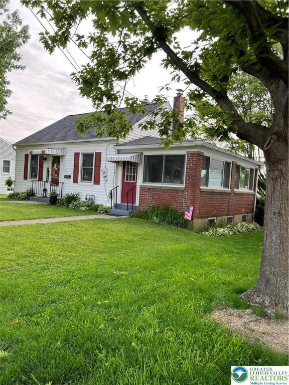 1540 Riegel St, Hellertown Borough, PA 18055 - view of front facade featuring a front lawn, brick siding, and entry steps