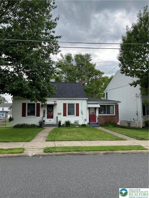 1540 Riegel St, Hellertown Borough, PA 18055 - view of front of property featuring a front lawn, entry steps, and a chimney