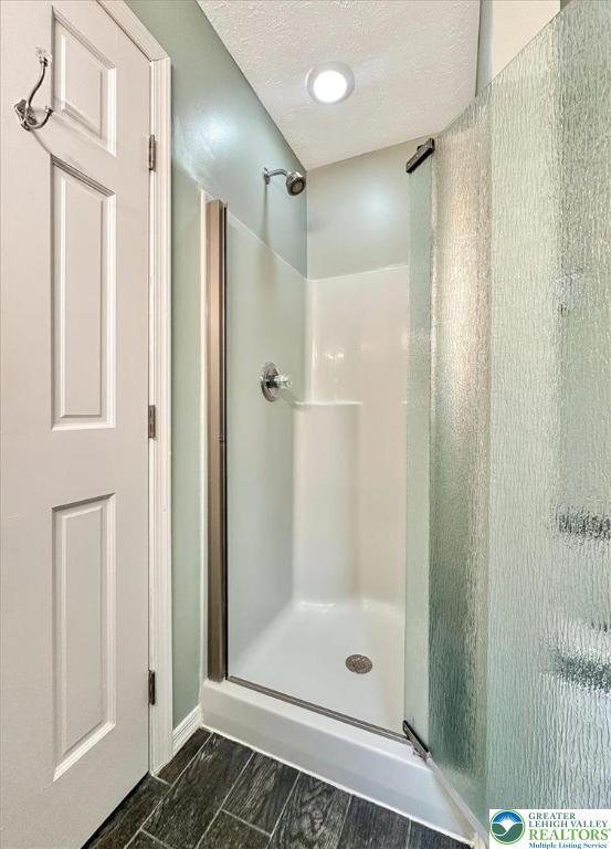 2330 Burntwood Dr, East Stroudsburg, PA 18301 - full bath featuring a shower stall and baseboards