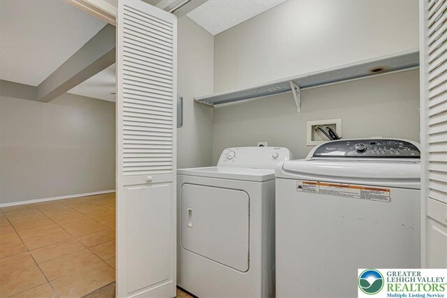 2330 Burntwood Dr, East Stroudsburg, PA 18301 - laundry room featuring washing machine and dryer and light tile patterned flooring