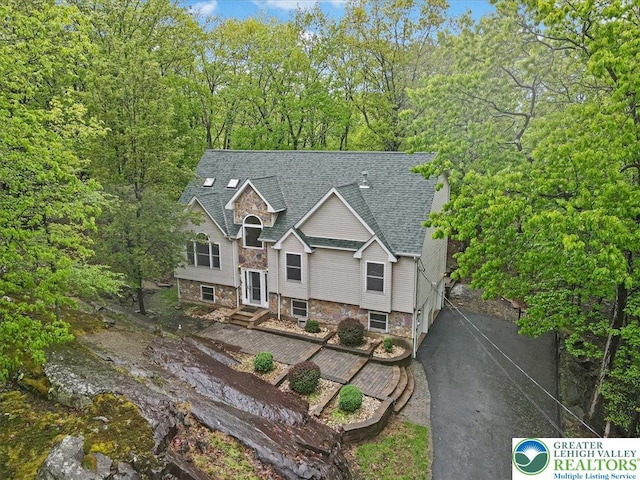 2330 Burntwood Dr, East Stroudsburg, PA 18301 - view of front facade with a shingled roof and stone siding