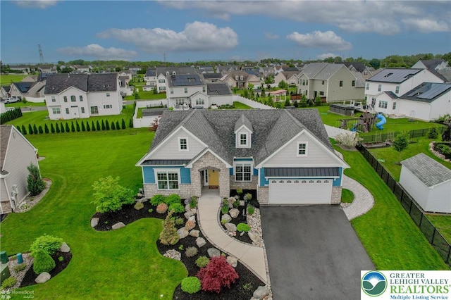 1050 Lisa Ln, Palmer Twp, PA 18045 - view of front of home featuring stone siding, a residential view, an attached garage, and driveway