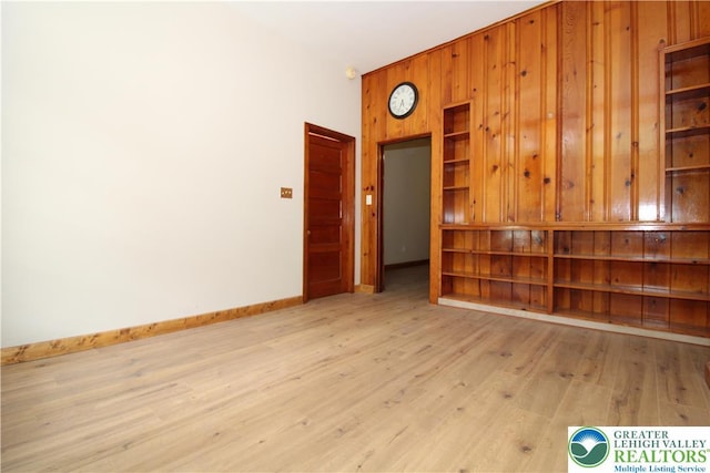 1171 E 4th St, Bethlehem City, PA 18015 - spare room featuring light wood-style floors, baseboards, and wooden walls