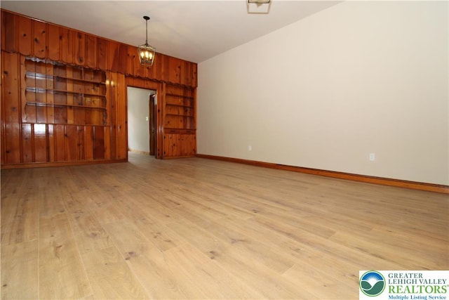1171 E 4th St, Bethlehem City, PA 18015 - spare room with wooden walls, light wood finished floors, and baseboards