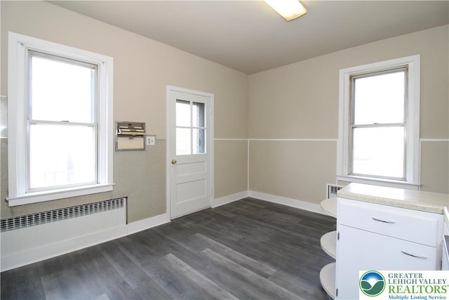 1171 E 4th St, Bethlehem City, PA 18015 - spare room featuring radiator heating unit, dark wood finished floors, and baseboards