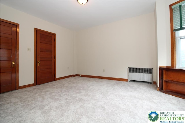 1171 E 4th St, Bethlehem City, PA 18015 - unfurnished room featuring radiator heating unit, carpet flooring, and baseboards