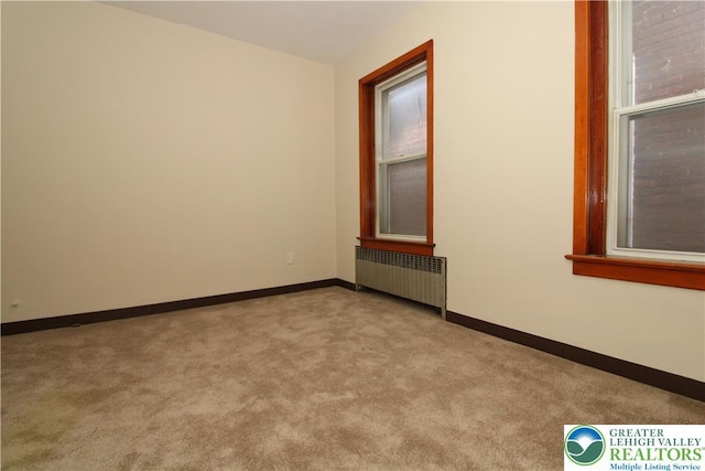 1171 E 4th St, Bethlehem City, PA 18015 - carpeted spare room with radiator and baseboards