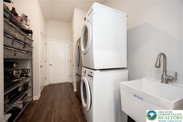 7911 Schaefer Crst, Upper Macungie Twp, PA 18031 - washroom featuring stacked washer and clothes dryer and dark wood-type flooring