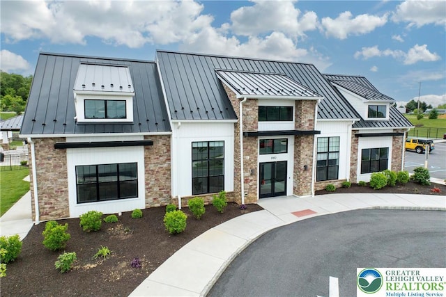 7911 Schaefer Crst, Upper Macungie Twp, PA 18031 - view of front of home featuring a standing seam roof, metal roof, and stone siding