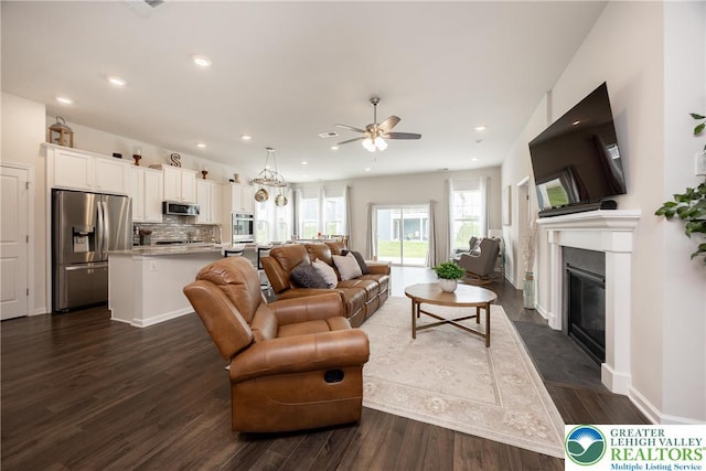 7911 Schaefer Crst, Upper Macungie Twp, PA 18031 - living area with a ceiling fan, dark wood-style floors, a fireplace with flush hearth, recessed lighting, and baseboards