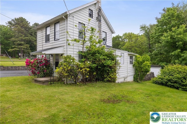 735 Beaver Run Dr, Mahoning Township, PA 18235 - view of side of home with a yard