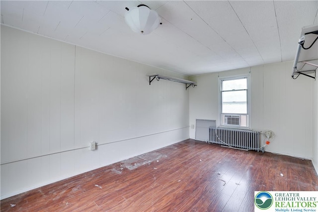 735 Beaver Run Dr, Mahoning Township, PA 18235 - below grade area featuring radiator heating unit and hardwood / wood-style floors