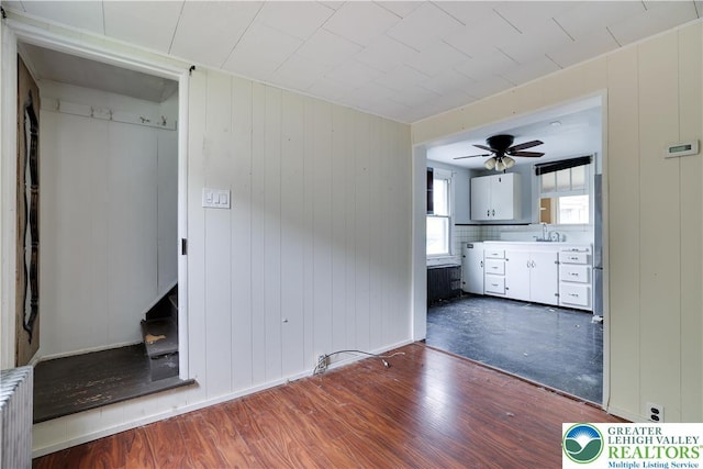 735 Beaver Run Dr, Mahoning Township, PA 18235 - unfurnished living room with wood finished floors, radiator, ceiling fan, and a sink