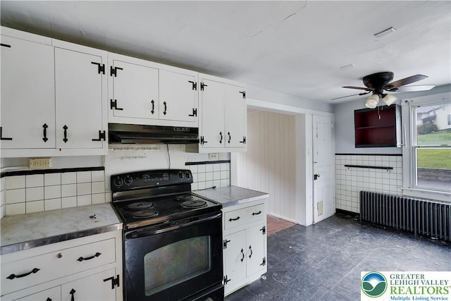 735 Beaver Run Dr, Mahoning Township, PA 18235 - kitchen featuring black electric range oven, under cabinet range hood, radiator heating unit, ceiling fan, and white cabinets