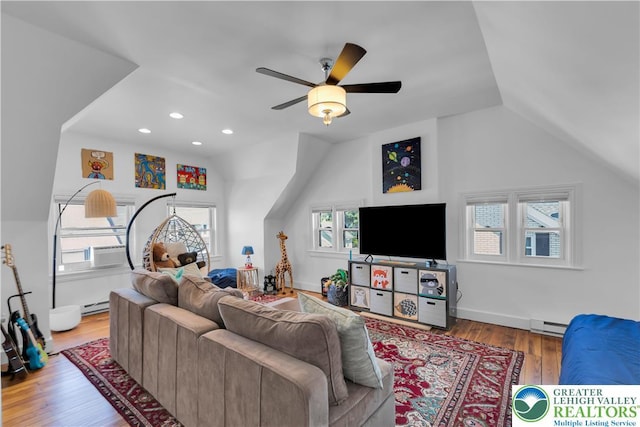426 3rd Ave, Bethlehem City, PA 18018 - living area featuring a baseboard heating unit, ceiling fan, wood finished floors, vaulted ceiling, and recessed lighting