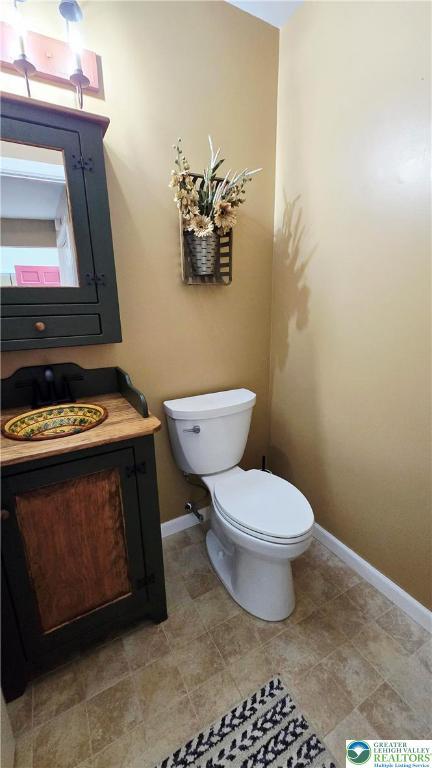 2872 Sheffield Dr, Lower Macungie Twp, PA 18049 - bathroom featuring toilet and baseboards