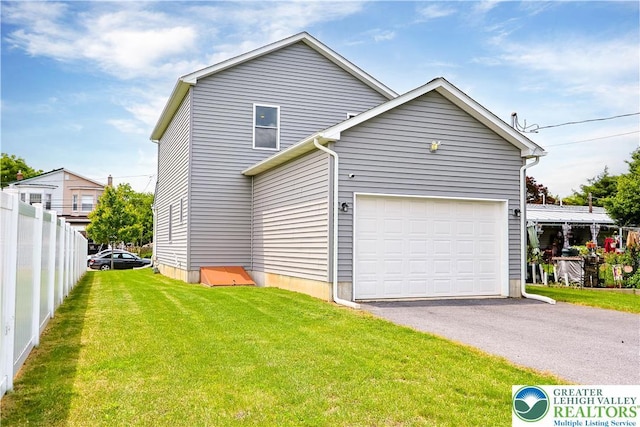 721 7th St, Whitehall Twp, PA 18052 - view of property exterior featuring a garage and asphalt driveway