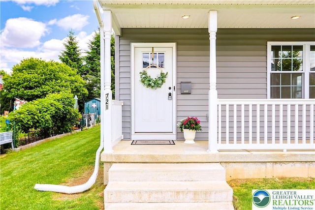 721 7th St, Whitehall Twp, PA 18052 - entrance to property with covered porch and a lawn